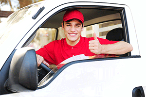 Guy with thumbs up in a car with Commercial car Insurance in Atlanta, GA, Decatur, Fairburn, Riverdale, GA, and Surrounding Areas